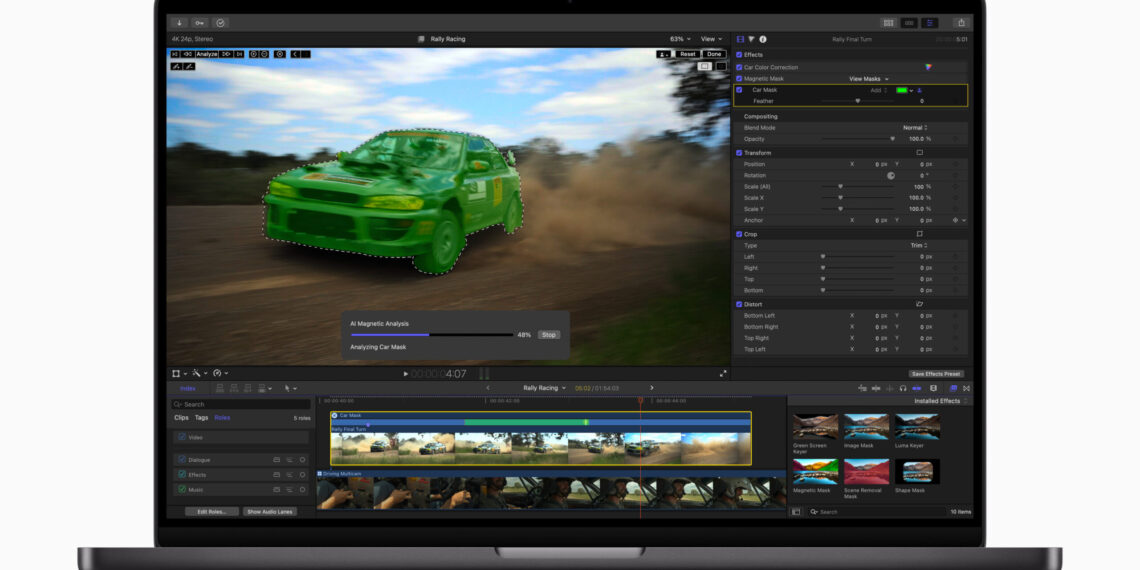 Magnetic Masking demonstration in Final Cut Pro 11 running on a MacBook, showing a car highlighted in green in the edit window plus a status dialog, timeline view open.