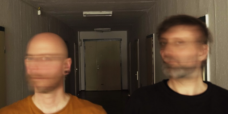 two men with blurred faces